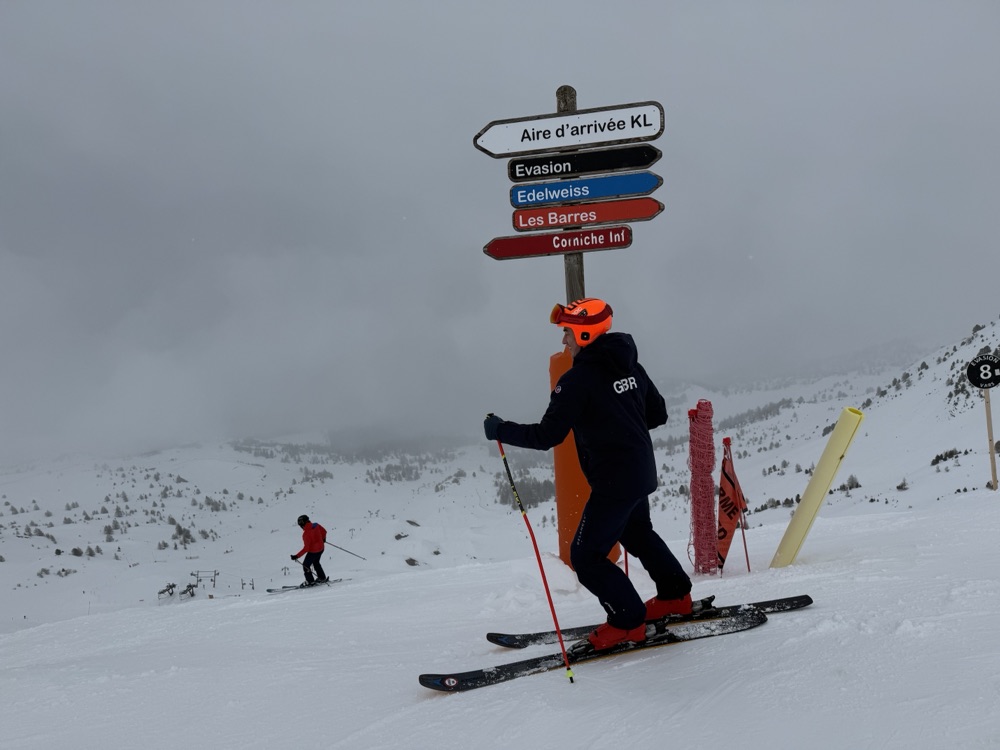 Jan Farrell in Great Britain team kit below the finish-area sign at Vars